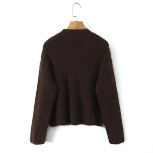 Rear view of a fluffy dark brown mohair knit sweater on a wooden hanger with clean neckline