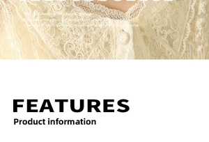 Detailed view of cream lace fabric featuring intricate embroidery and a round metal button