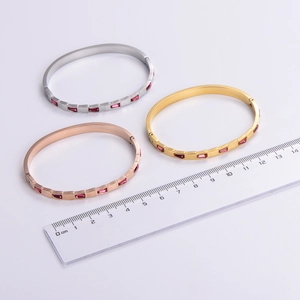 Three-piece stainless steel bangle set with pink square gems in gold silver and rose gold
