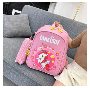 Pink unicorn kids backpack set with matching pencil case shown in a lifestyle scene