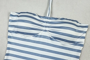 Detail of the blue and white striped fabric with ruched chest design on a jumpsuit