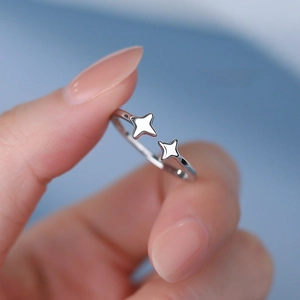 Elegant S925 sterling silver open ring featuring a minimalist double starburst design