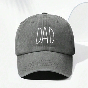 Close-up of white DAD embroidery on a vintage grey washed cotton baseball cap