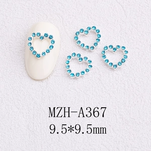 Detail of MZH-A367 blue rhinestone hollow heart nail charm on white background