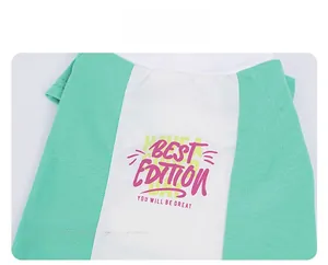 Detailed view of breathable mint green and white pet shirt with graphic typography print