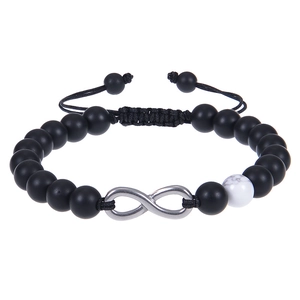 Close-up of matte black beads and white turquoise bracelet with infinity charm