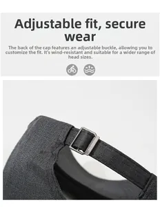 Detailed view of the adjustable metal buckle on this dark grey cotton baseball cap