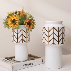 Modern white ceramic vases with gold geometric patterns for elegant home decor