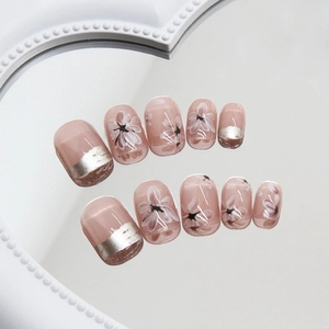 Kurze runde Kunstnägel in Transparent-Rosa mit floralem Design und silbernen Katzenaugen-Tips