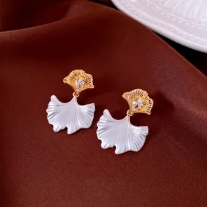 Elegant ginkgo leaf earrings with gold water drop zircon and white enamel finish