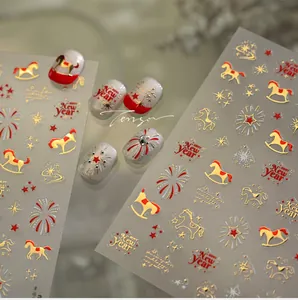 Detailed macro view of 3D embossed gold rocking horse and firework nail art stickers