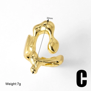 Detail view of irregular fluid gold ring showing dimensions of 32mm height and 17mm diameter