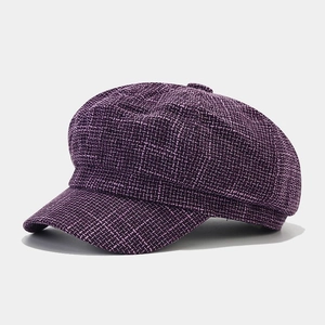 Detailed view of the purple tweed texture on the British style newsboy octagonal cap