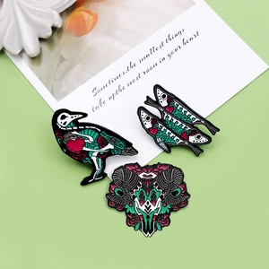 Gothic animal skull enamel pin set featuring crow, fish, and ram bone designs
