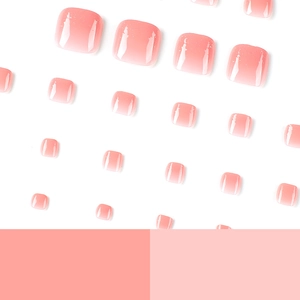 Pink gradient press-on toenails with silver glitter finish on white background