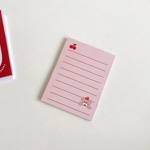 Macro shot of pink sticky notes with cherry and cute bear patterns and lined paper