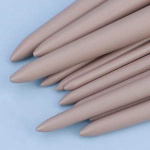 Close-up of taupe matte makeup brush handles with smooth skin-friendly coating