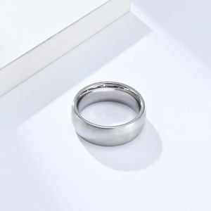 Close-up of 8mm brushed matte stainless steel ring with polished inner surface
