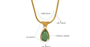 Detailed view of green glass stone teardrop pendant on gold-plated snake chain