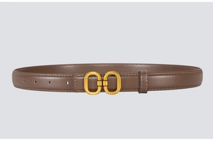 Detail of slim dark brown leather belt featuring a matte gold double ring buckle closure
