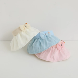 Detailed view of kids' sun visors in beige, blue, and pink with mesh bow decoration