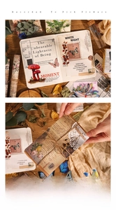 Close-up of vintage PET floral and butterfly stickers with textured paper for scrapbooking
