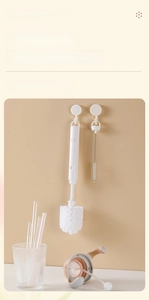Detail of white long-handle cup brush and straw cleaner set with hanging hole for storage