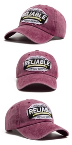 Detail of vintage washed cotton baseball cap featuring embroidered patches and retro texture