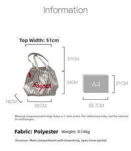Size comparison of striped canvas tote bag with A4 paper showing 51cm width and dimensions