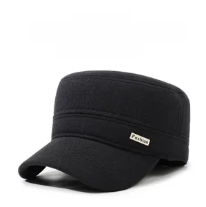 Detail view of winter flat top cap with wool texture and metal fashion side emblem