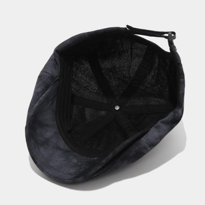 Internal view showing breathable mesh lining and adjustable strap on the vintage newsboy cap