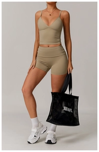 Detail view of olive green ribbed yoga set with V-neck crop top and high waist shorts