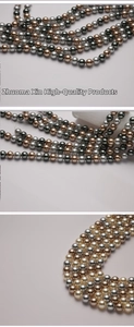 Detail of 8-12mm mixed color glass pearls with high luster in silver and gold shades