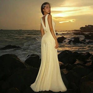 Detailed back view of a slim-fit backless dress with mesh splicing and elegant lace-up style