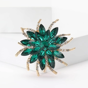 Exquisite gold sunflower brooch with deep green crystals and shimmering micro-diamonds