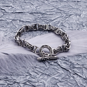 Bracciale vintage in acciaio inossidabile con chiusura OT e motivi in rilievo