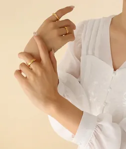 Detailed view of 18K gold plated stainless steel rings with star patterns and zircon
