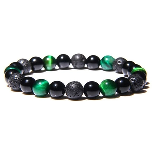 Macro detail of 8mm green tiger eye, black obsidian and volcanic lava energy beads