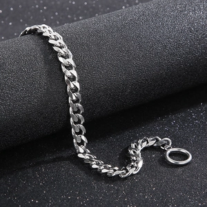 Detail of silver stainless steel Cuban chain bracelet with OT toggle clasp on display