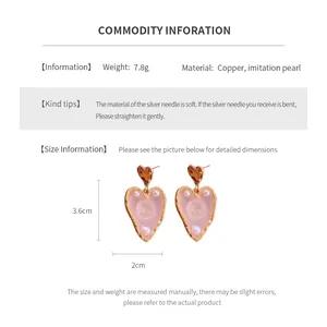 Detailed view of heart pearl earrings with size 3.6x2cm and materials information