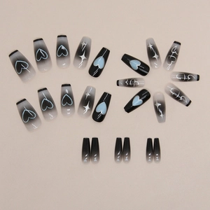 Ballerina nails with black ombre gradient, heart patterns and silver star designs