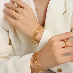 Elegant 18k gold plated stainless steel knot bracelet and ring set for women