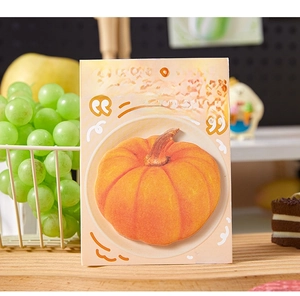 Macro shot of realistic pumpkin-shaped sticky notes from the Plate of Food series