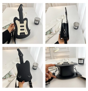 Detail view of guitar shaped crossbody bag with black contrast panels and wide strap