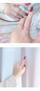 Close-up of elegant gold and rose gold wavy rings with sparkling diamonds for women