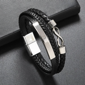 Detail of multi-layer braided leather bracelet with infinity symbol and magnetic clasp