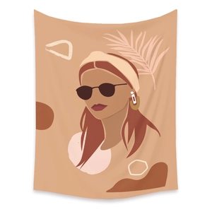 Detail view of Bohemian tapestry featuring minimalist abstract female illustration and palm leaves