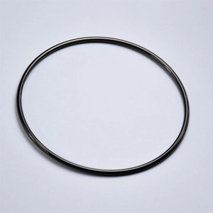 Top-down view of a minimalist 2mm titanium steel bracelet with 18K gold plated finish