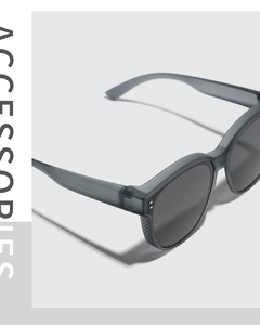 Detail of matte gray TR90 sunglasses frame with double rivets and modern hinges