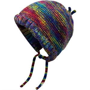 Detailed knit texture of colorful rainbow striped winter hat with cozy ear flaps and ties